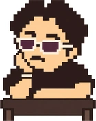サングラスをかけ、机で頬づえをつく人物のドット絵